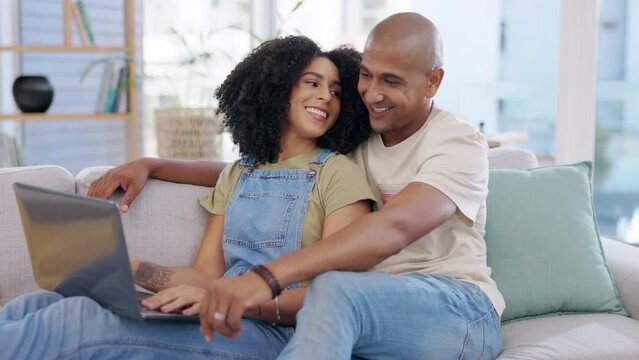 Laptop, couple and smile on sofa in home living room, social media or online shopping. Relax, computer and happiness of man and woman on couch web browsing, watching or streaming video together.