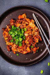 Fried kimchi with pork onions and spices. Traditional Korean food