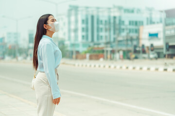 Asian Women wearing  Protection Mask feels headaches and cough due to air pollution PM 2.5  Air pollution caused health problems. environmental pollution