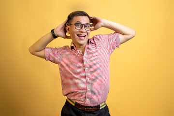 Man with eyeglasses and a shirt standing