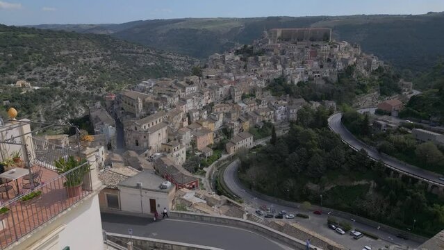 iconic view of Ragusa Ibla flying backwards