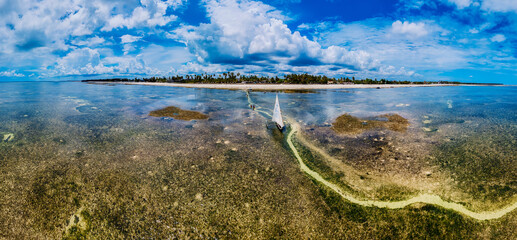 A wooden fishing boat with a traditional design, commonly found in Tanzania and located in the Indian Ocean near Zanzibar.