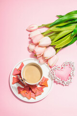 Valentine's Day romantic concept. Morning coffee, a bouquet of tulips, symbolic decor