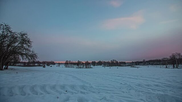 Timelapse of vast snowy landscape in the winter. frozen winter forest all covered in white snow. clouds moving in the blue sky.