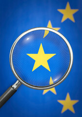 Lupe vergrößert Stern auf EU-Flagge - Transparenz in der EU