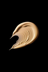 Beige cosmetic cream swatch isolated on a black  background. Foundation cream smear texture