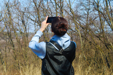 man with camera in nature