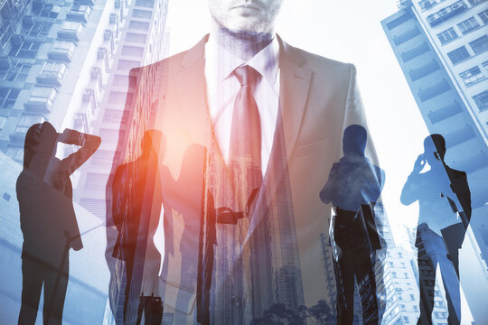 Headless young man standing on abstract bright city background with crowd. Success, work, job and career concept. Double exposure.