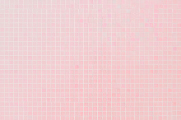 Colorful pink ceramic wall and floor grid tiles abstract background. Design geometric mosaic texture decoration.
