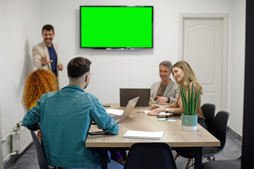 Business team on a morning briefing; business meeting and presentation in a modern office
