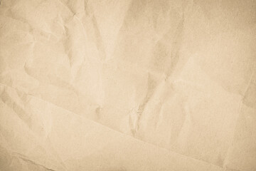 Brown recycled craft paper texture as background. Cream paper texture, Old vintage page or grunge vignette. Pattern rough art creased grunge letter. 