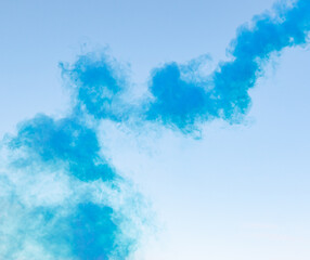 blue smoke against the blue sky