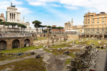 Fototapeta na wymiar Ruins of Imperial Forums on a Summer day in Rome, Italy. Roman archaeological park.