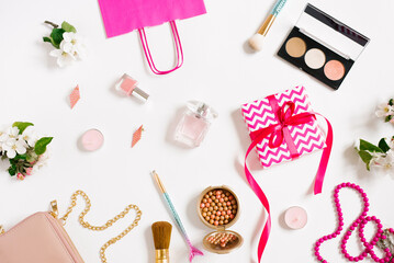 Beautiful layout on a white background. Cosmetics, apple tree flowers. Flat layout, space for copying. Fashion concept.