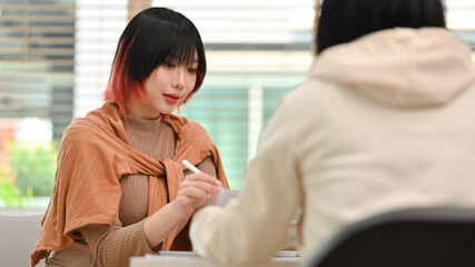 Team of designers collaborating on new startup project at creative workplace. Design, innovations and media concept