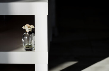 Glass perfume bottle on desk