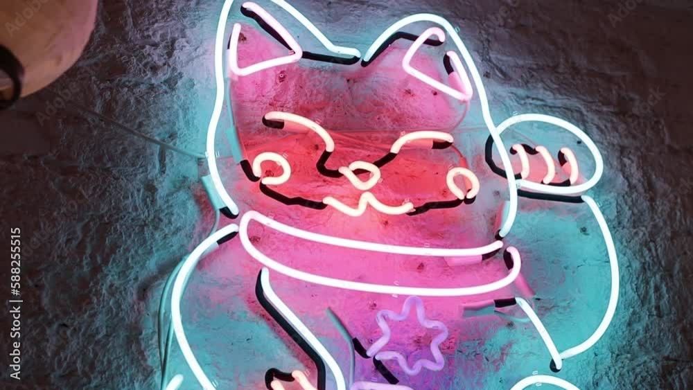 Wall mural Neon sign with a picture of a Japanese cat