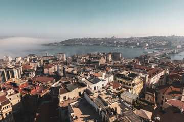 Fototapeta na wymiar Aerial view of Istanbul from Galata tower, Istanbul panorama from the top with fog over Bosphorus, Istanbul, Turkey