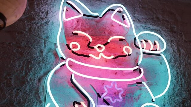 Neon sign with a picture of a Japanese cat