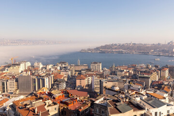 Obraz premium Aerial view of Istanbul from Galata tower, Istanbul panorama from the top with fog over Bosphorus, Istanbul, Turkey