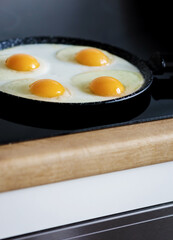 fried eggs in a frying pan