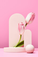 podium with pink tulips and arch on pink background.