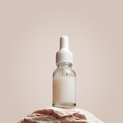 Glass dropper bottle with white liquid essence, serum, cream on stand from natural stone, minimal beige gradient background. Natural Cosmetic, monochrome aesthetic mockup cosmetic product
