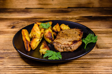 Roasted beefsteak with the fried potato and parsley