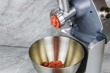 Making ground meat in modern food processor with the meat grinder