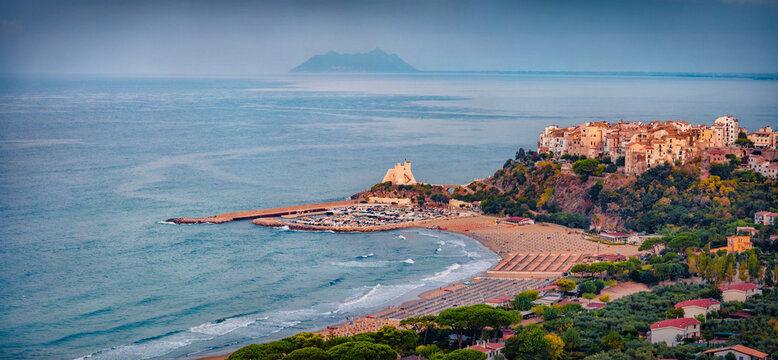 Panoramic summer cityscape of Sperlonga town with Truglia Tower. Astonishing morning seascape of Mediterranean coast of Italy, Europe. Traveling concept background.