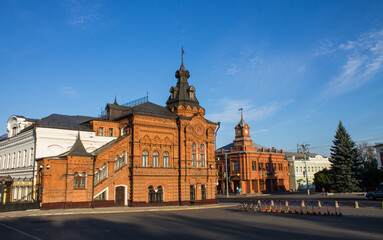 Fototapeta na wymiar VLADIMIR, RUSSIA - AUGUST, 17, 2022: the historic brick facade of the Friendship House and the City Duma building in the old town on a sunny summer day and copy space