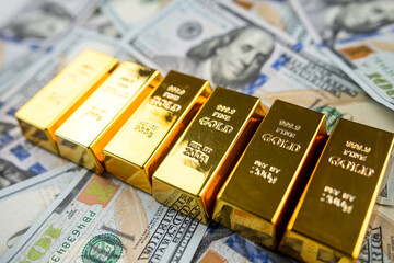 Gold bars in 100 dollar bills financial asset