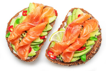 Salmon toasts with avocado isolated on white background. Top view.