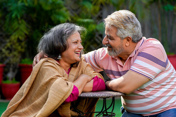 Indian senior couple enjoying and spending time together at out of home.