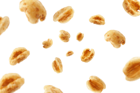 Falling puffed Wheat cereal, isolated on white background, selective focus