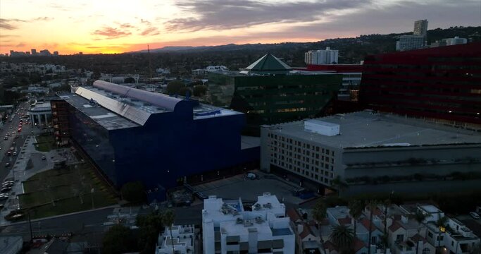 Pacific Design Center and surrounding buildings in West Hollywood, California at sunset - aerial