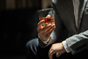 Businessman pouring whiskey victory drink