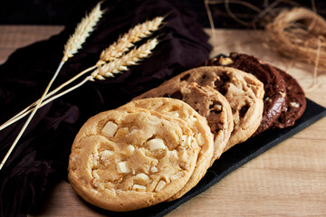 Freshly homemade chocolate cookies on a chalkboard