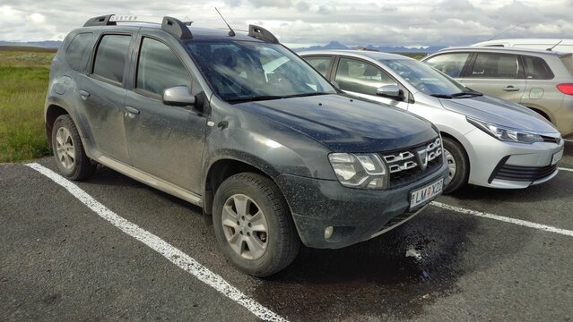 Dirty Dacia Duster car parked outside after off-road ride in Iceland
