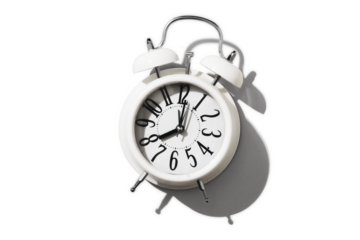 White alarm clock on empty white background, minimalism concept sleep, education, time, banner, top view, copy space