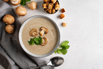 Mushroom soup close up with ingredient on white table