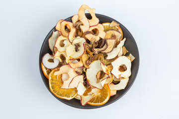 Dried fruits isolated on white background. Healthy eating concept. Top view. Healthy vegetarian food concept. Dried fruit chips.