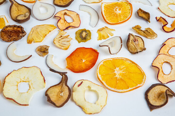 Dried fruits isolated on white background. Healthy eating concept. Top view. Healthy vegetarian food concept. Dried fruit chips.