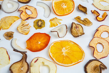 Healthy vegetarian food concept. Assortment of dried fruits, nuts and seeds on white background. Top view. Mixed nuts set closeup.