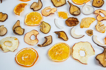 Fototapeta na wymiar Dried fruits isolated on white background. Healthy eating concept. Top view. Healthy vegetarian food concept. Dried fruit chips.