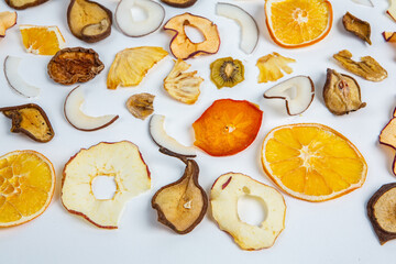 Dried fruits isolated on white background. Healthy eating concept. Top view. Healthy vegetarian food concept. Dried fruit chips.
