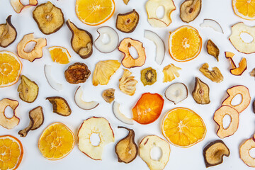 Dried fruits isolated on white background. Healthy eating concept. Top view. Healthy vegetarian food concept. Dried fruit chips.