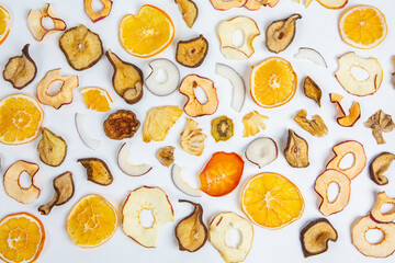 Dried fruits isolated on white background. Healthy eating concept. Top view. Healthy vegetarian food concept. Dried fruit chips.