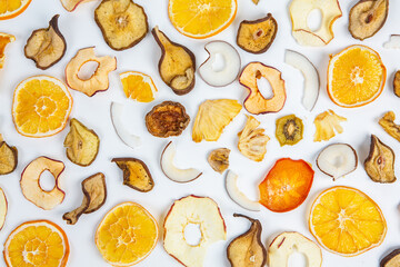 Dried fruits isolated on white background. Healthy eating concept. Top view. Healthy vegetarian food concept. Dried fruit chips.