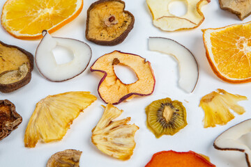 Healthy vegetarian food concept. Assortment of dried fruits, nuts and seeds on white background. Top view. Mixed nuts set closeup.